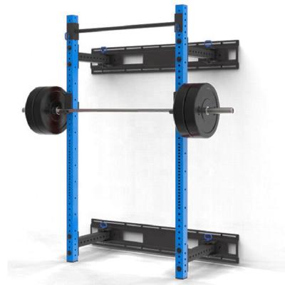 Rack de sentadillas plegable de pared para gimnasio